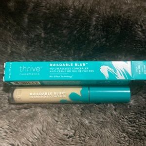 Buildable blur concealer by thrive in shade very fair warm.